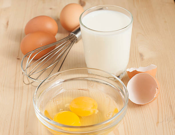 istock Raw chicken eggs and a glass of milk 487587139