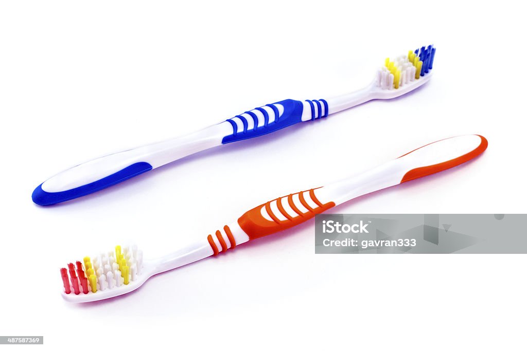 Two colorful toothbrushes Two colorful toothbrushes isolated on  white background Cut Out Stock Photo