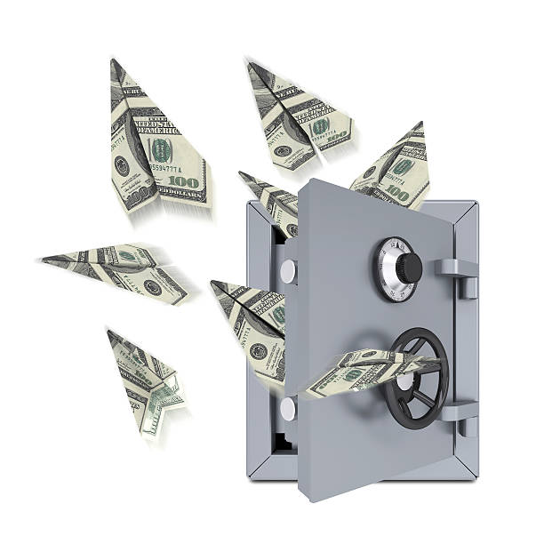 istock Paper airplanes of dollars from an open safe 487587391