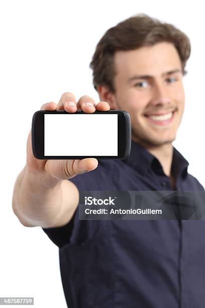 Handsome Young Man Showing A Blank Smart Phone Display Stock Photo - Download Image Now