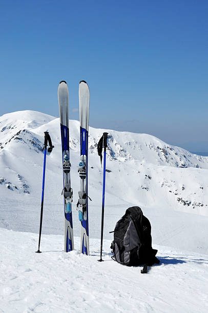 Skis, ski poles and backpack in Tatra mountains stock photo