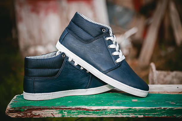 istock Men's shoes, sneakers on nature 487588876