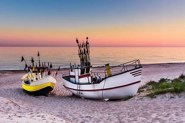 istock Fishing boat at sunrise 487589198