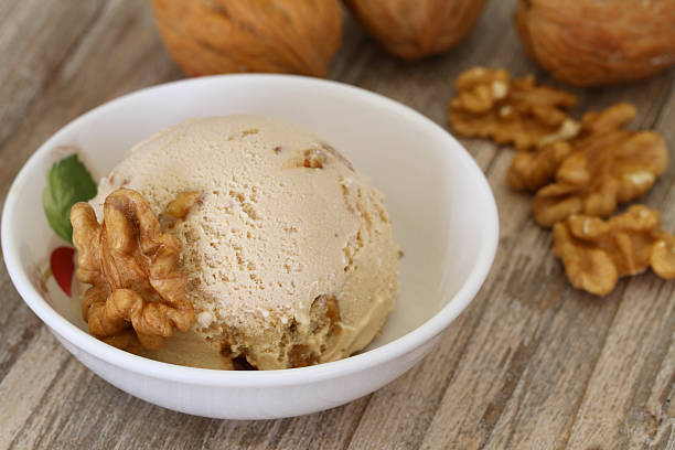 istock Walnut ice cream scoop in porcelain bowl 487589335