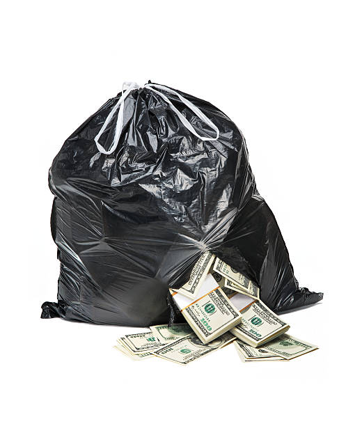 Bag full of money studio photography of black plastic bag with hundred dollar bills on a white background dibs stock pictures, royalty-free photos & images