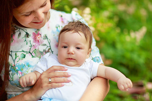 istock Mother play with baby son summer 487592048