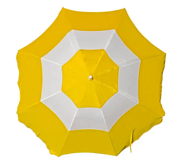 Opened beach umbrella with yellow and white stripes isolated on white. Top view. Clipping path included.