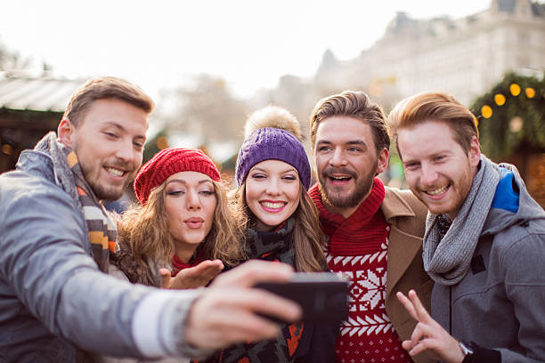 istock Friends having fun outdoors in winter city. 487592140