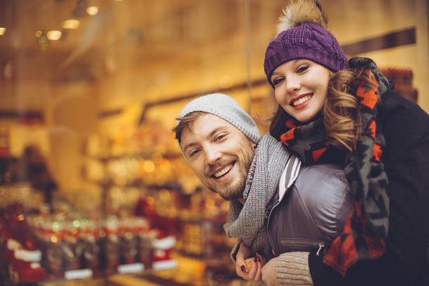 istock Couple having fun outdoors in winter city. 487592212