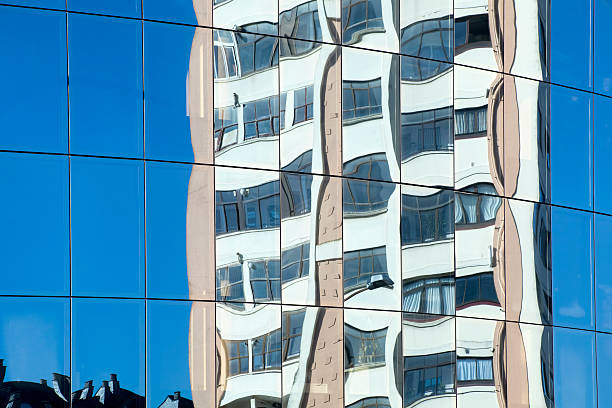 istock Building and blue sky reflection on a glass facade 487593292
