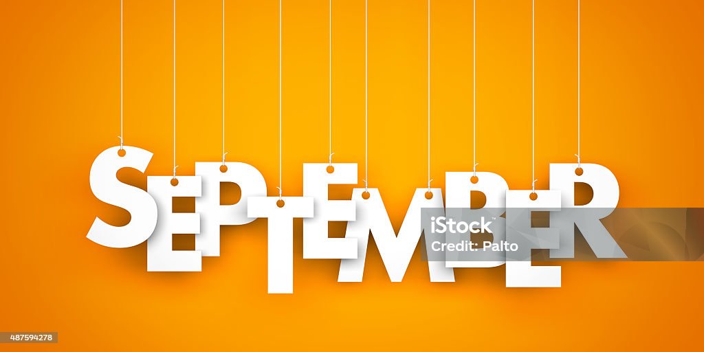 September September - text hanging on the strings September Stock Photo