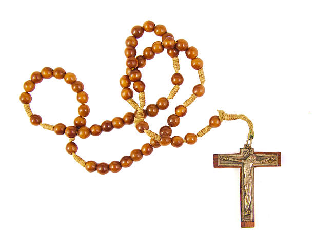 istock Wooden rosary beads and cross isolated on a white background 487596862