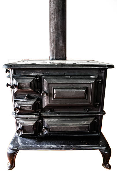 istock Old antique wood stove isolated on white background 487599606