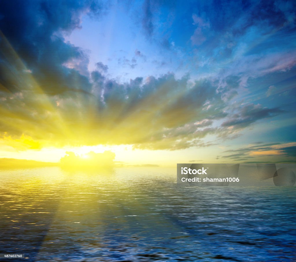 dramatic landscape colorful dramatic landscape with water and cloudy sky at sunset 2015 Stock Photo