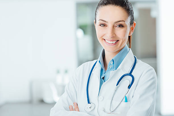 istock Confident female doctor posing in her office 487605540