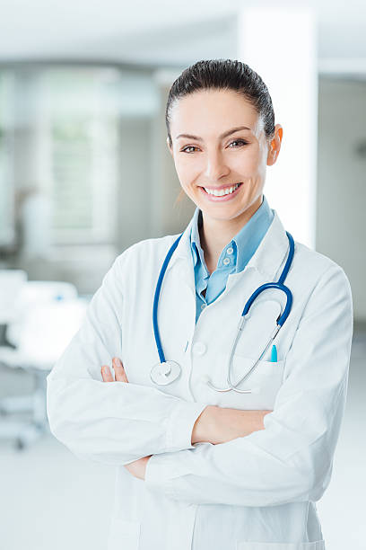 istock Confident female doctor posing in her office 487605544