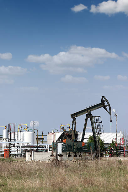istock refinery and oil pump jack oilfield 487606319
