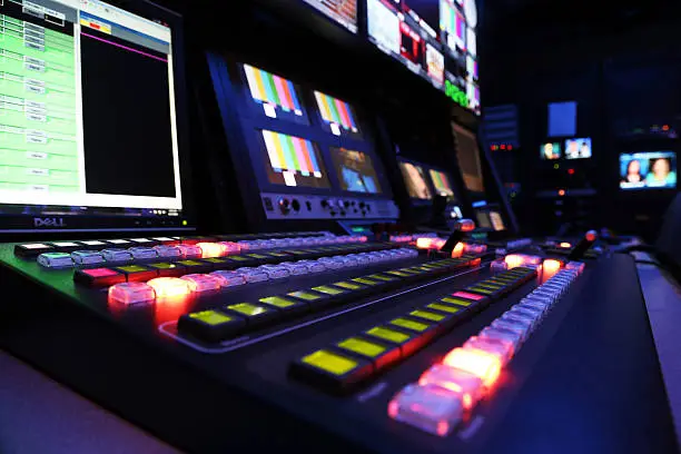 View of a TV production switcher in a broadcast television control room setting
