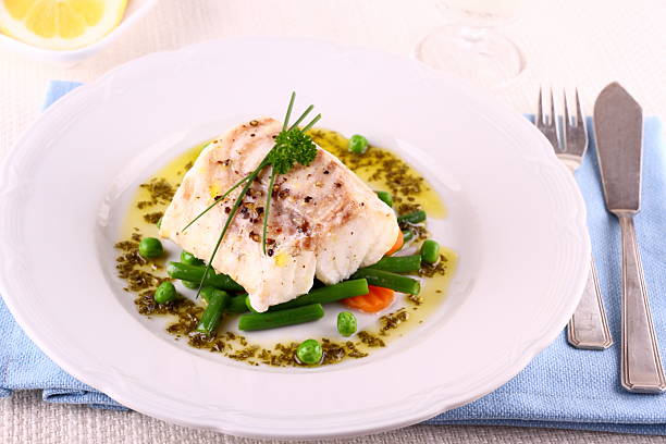 istock Cod Fillet with green beans, peas, parsley, olive oil 487607041