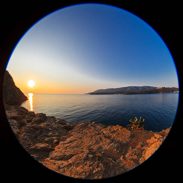 istock sunrise at sea. Fisheye lens image 487608085