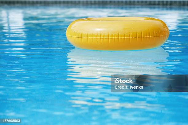 Floating Ring On Blue Water Swimpool With Waves Reflecting Stock Photo - Download Image Now