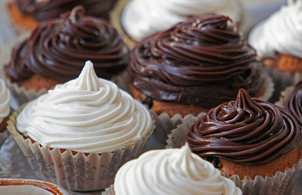 istock Cupcakes with vanilla and chocolate frosting. 487610415