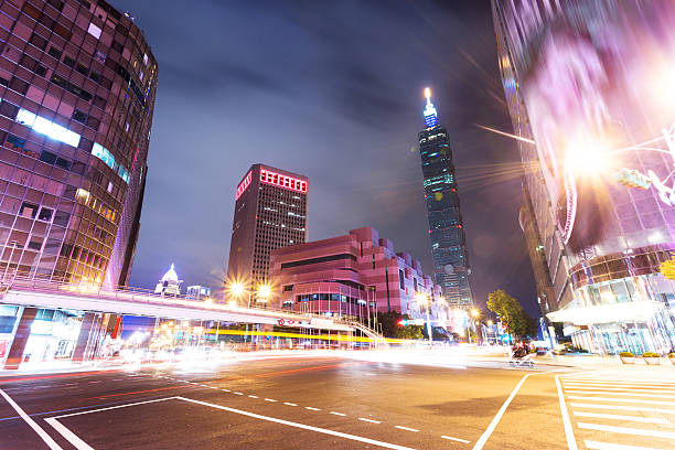 istock Car light trails and urban landscape in modern city 487610633