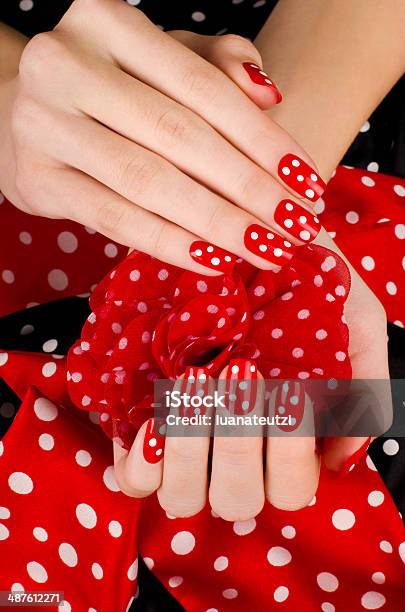 Beautiful Female Hands With Red Manicure And White Dots Stock Photo - Download Image Now