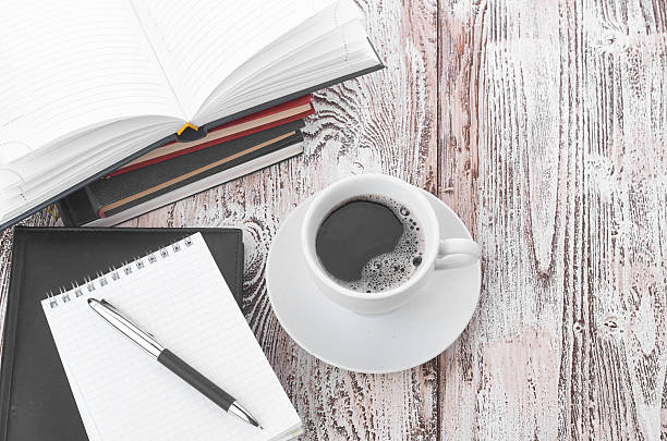 istock Cup of coffee on a wooden table 487613726