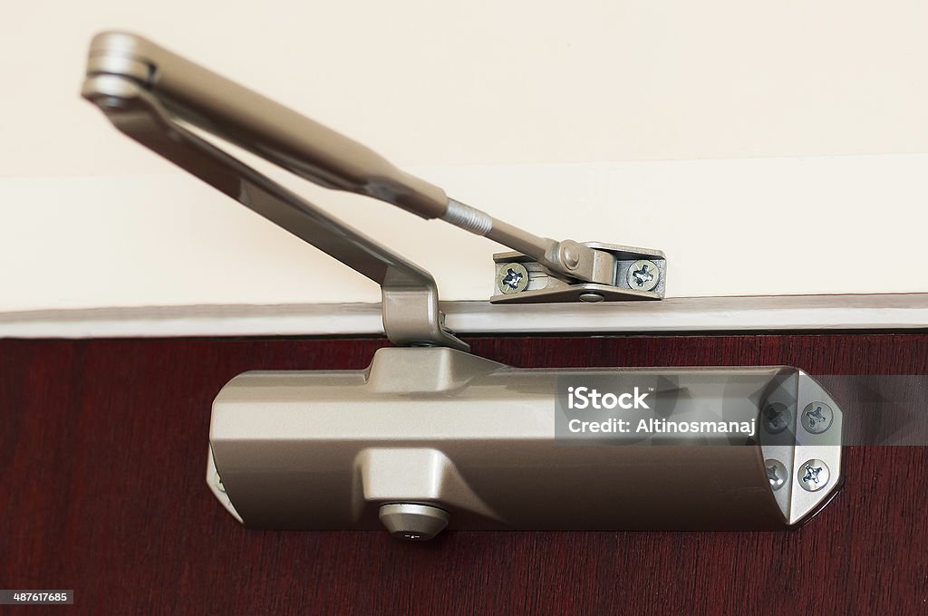 Automatic hydraulic leaver hinge door closer holder Door Stock Photo