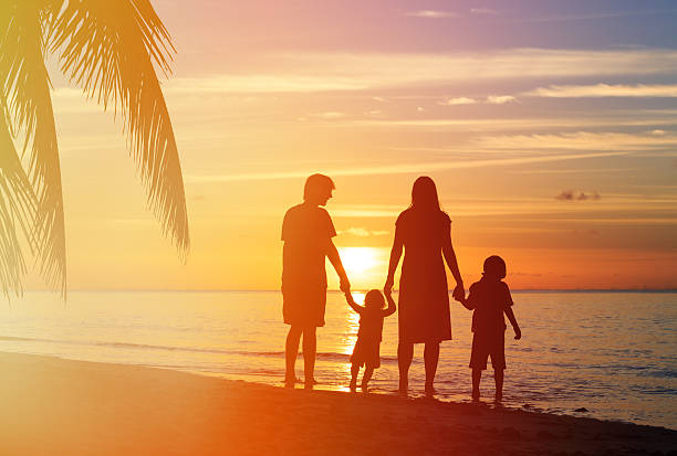 istock happy family with two kids having fun on sunset beach 487617890