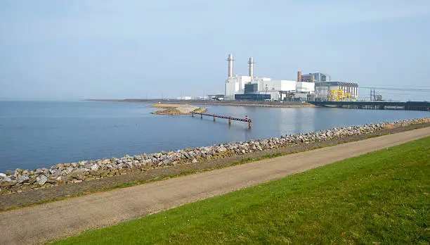 Power plant along a lake in spring
