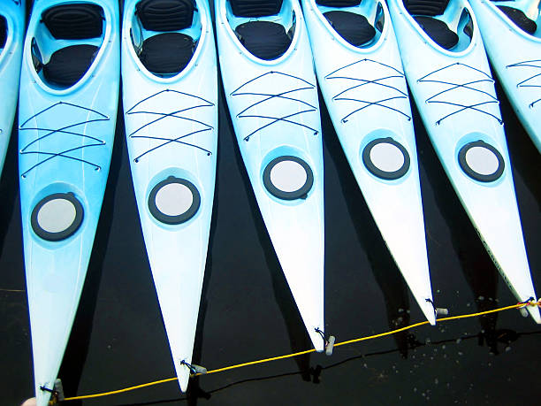 istock Light Blue Kayaks tied together 487618027