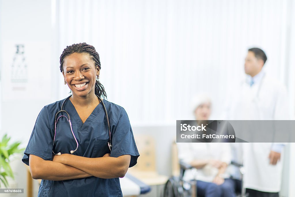 Doctors Office Mediacal team and patient. Adult Stock Photo