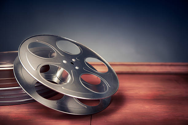 istock filmmaking scene with dramatic lighting, movie reel 487618668