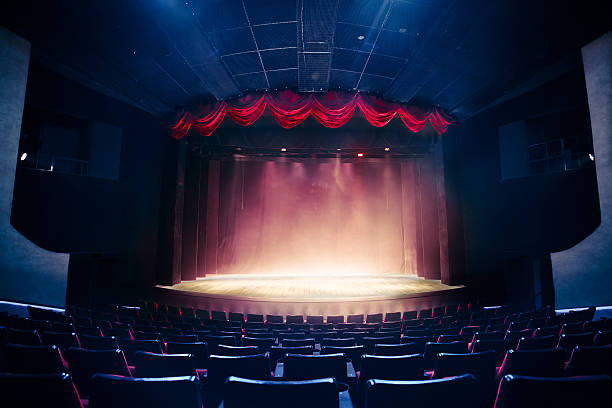 Theater curtain with dramatic lighting stock photo