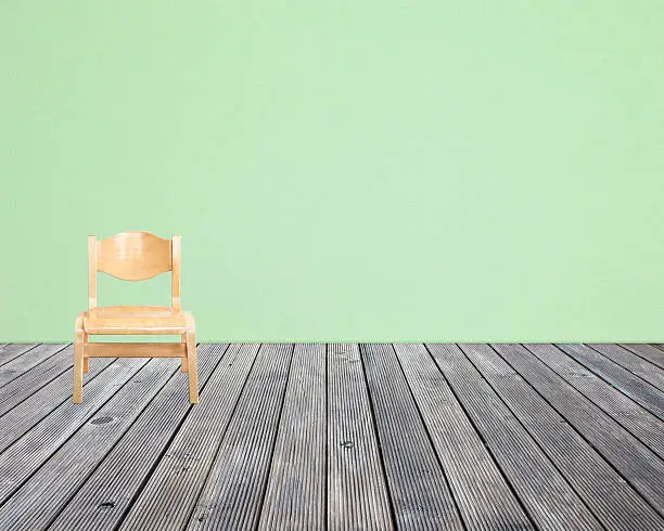 chair on wood floor and wall paper background