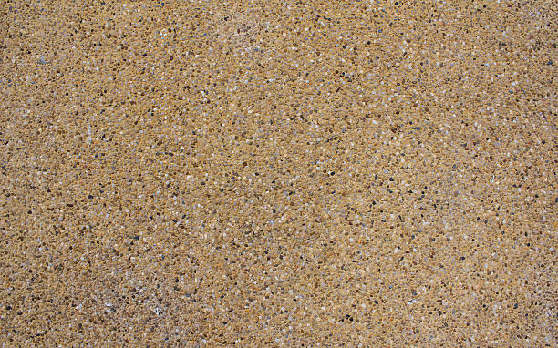 istock surface and texture of fine mix size gravel wall 487620787
