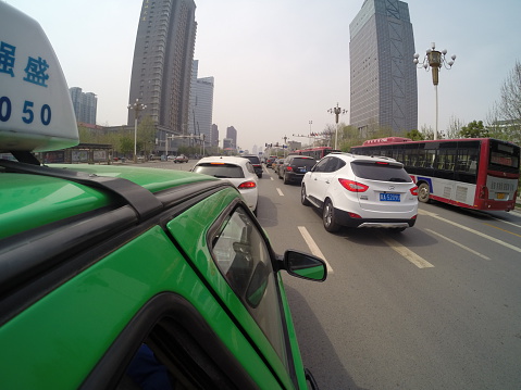 Shijiazhuang, China - April 6, 2014: A daily traffic problem in Shijiazhuang City, Hebei Province China. Photo taken with GoPro Hero 3+ Black Edition. Photo taken from Shijiazhuang City, Hebei Province, China. 