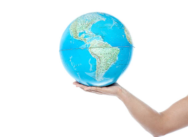 istock Closeup of man hand holding a globe 487622149