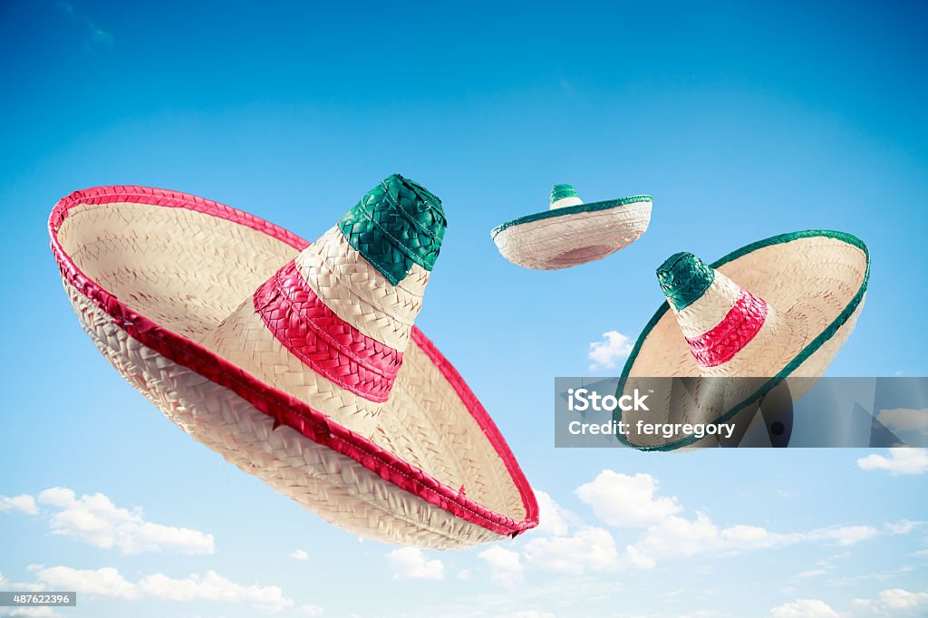 Mexican hat / sombrero in the sky Mexican sombreros in a blue sky Sombrero Stock Photo