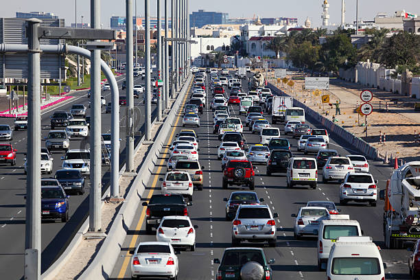 Abu Dhabi, UAE - December 25, 2013: Busy traffic on the city highway in Abu Dhabi, United Arab Emirates