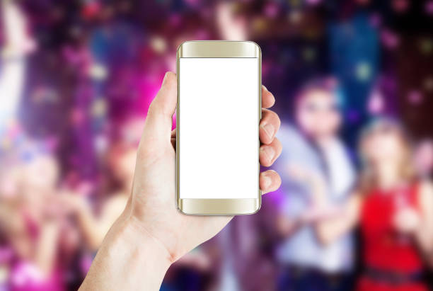 istock Hand holding smart phone with social background 487623112