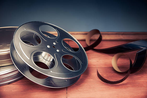 istock filmmaking scene with dramatic lighting, movie reel 487623682