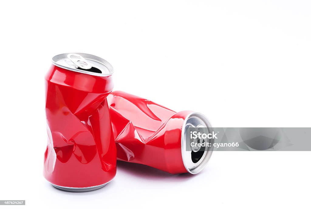 Red crushed cans Red crushed cans on white background, recycling and pollution concept. Crushed Stock Photo