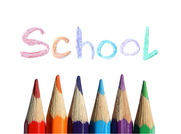 istock Colored pencils and the handwritten word School on white background 487626708