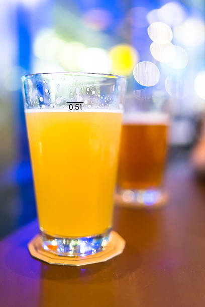 istock Beer glasses in the bar with bokeh light background 487626830