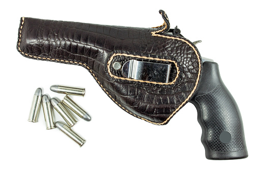 chrome gun .38 mm and bullets in holster