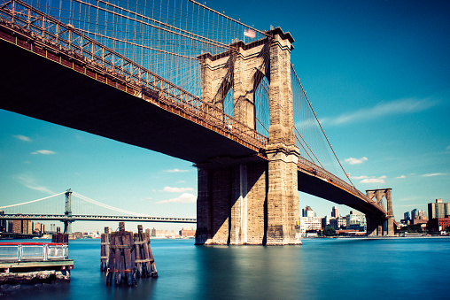 Long exposure under the Brooklyn Bridge in New York City.