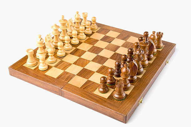 Chess pieces on a chessboard stock photo